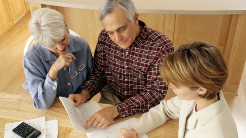 couple discussing retirement with advisor.jpg